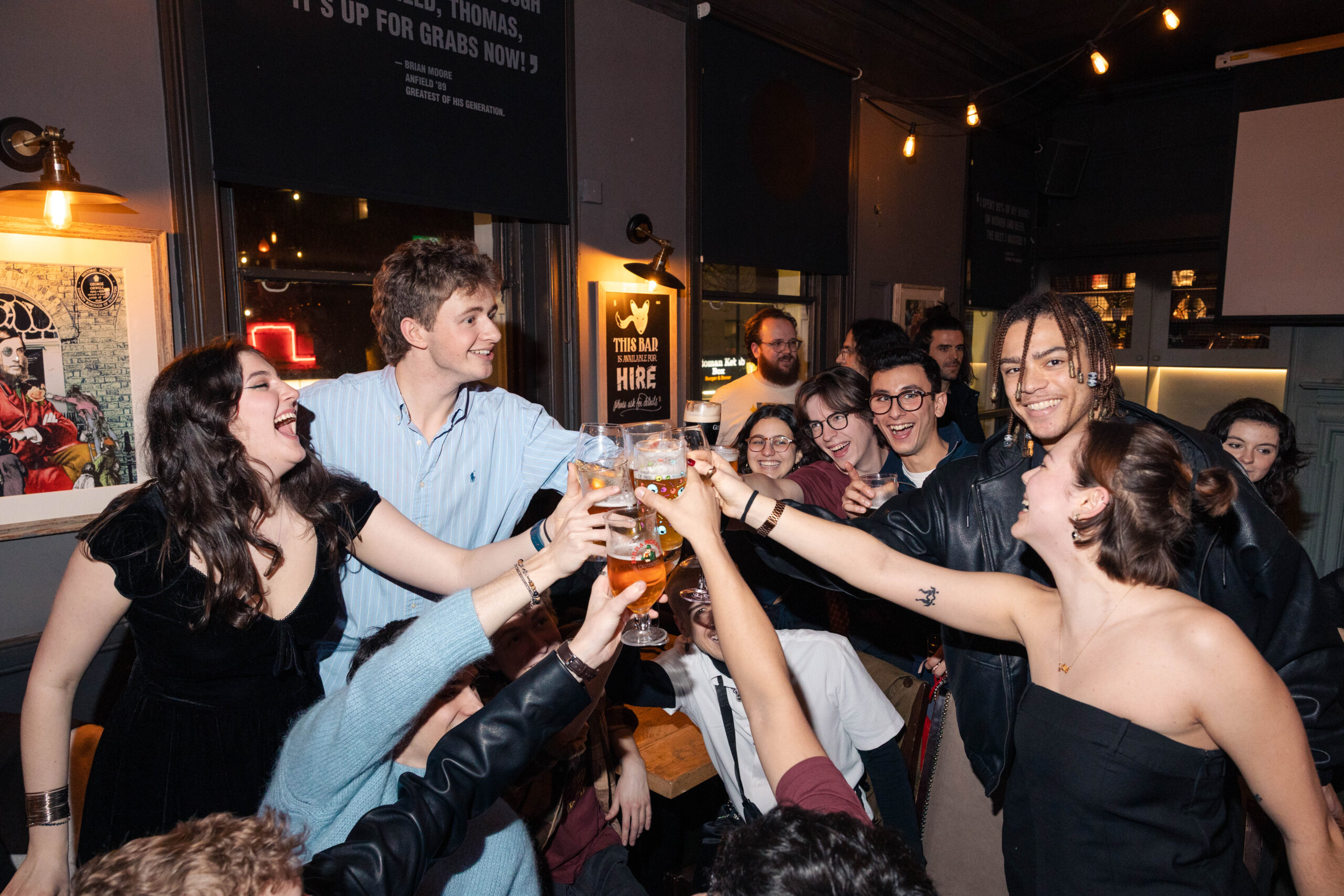 group of students cheersing with their drinks